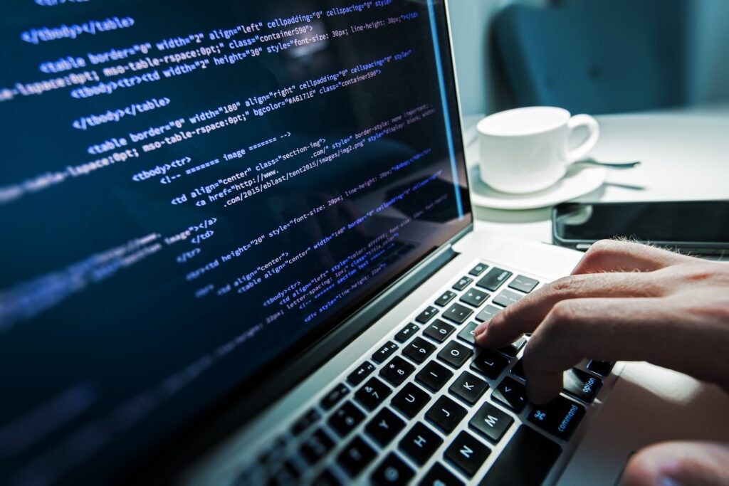 Man coding HTML on a website