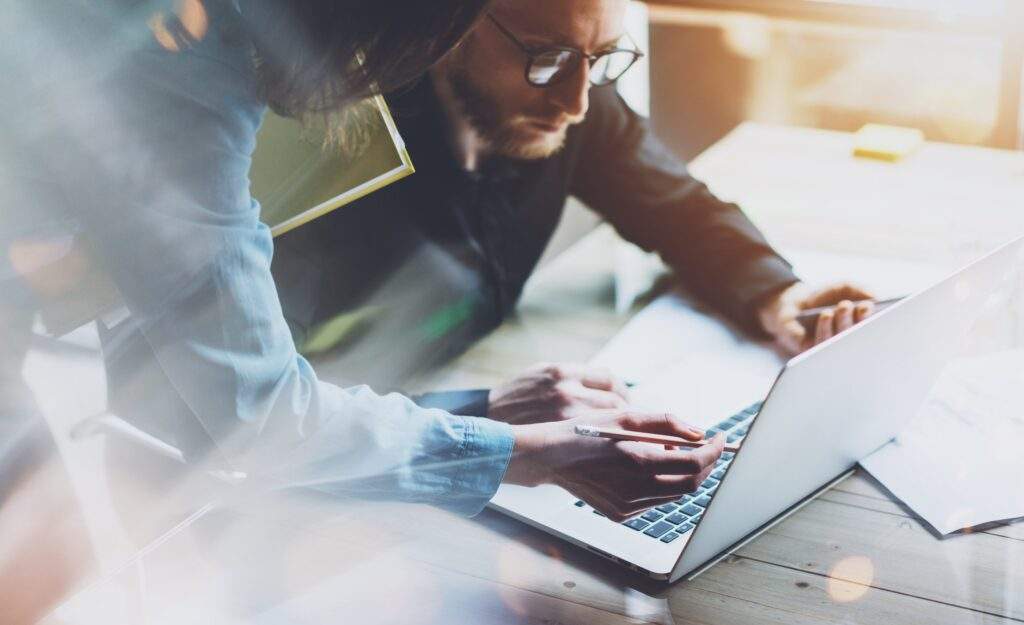 group of people working on a computer