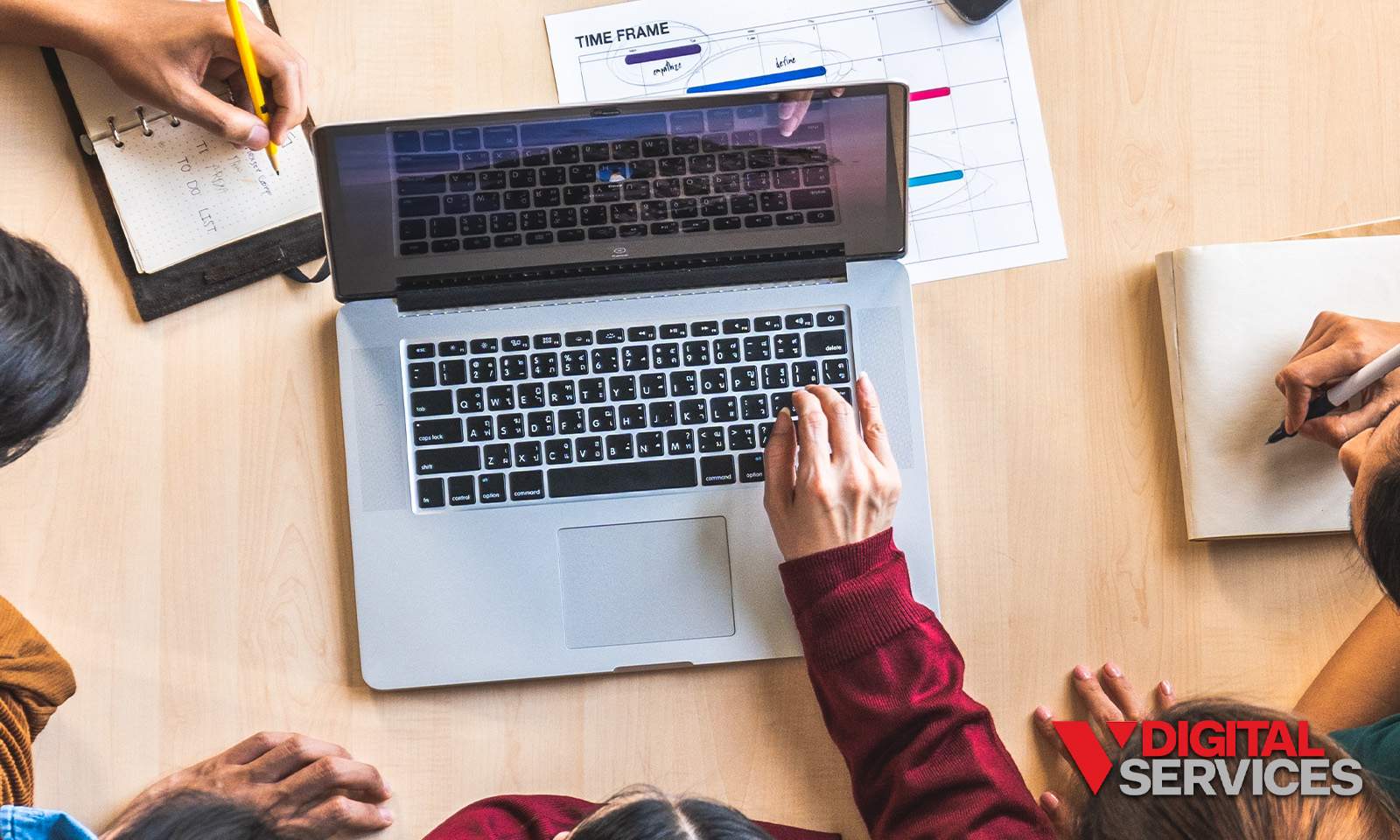 Marketing team reviewing analytics on a laptop